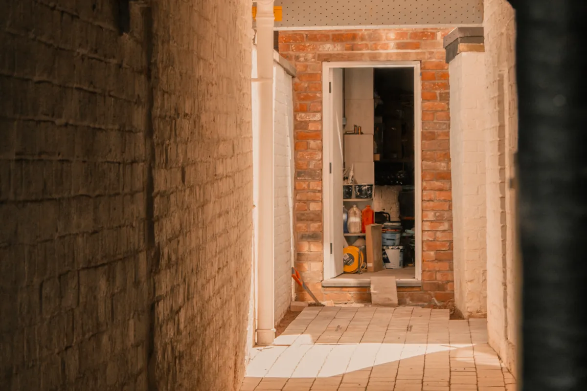 Brick side passage leading to a store at an English home
